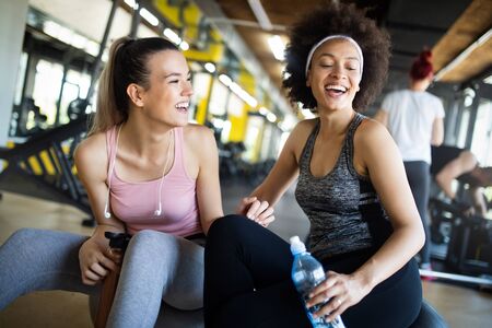 Picture of cheerful fitness team in gymの写真素材