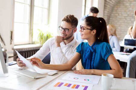 Business, technology and people concept - creative team or designers working in officeの写真素材