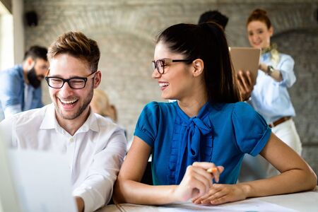 Group of young businesspeople or designers work with new startup project in office