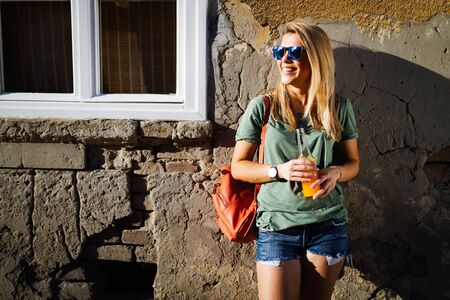 Urban lifestyle, hipster beautiful woman having fun on the street