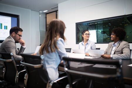 Successful group of business people at work in officeの写真素材