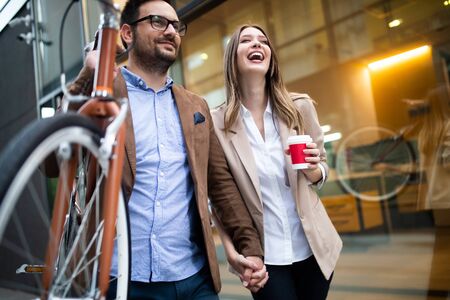 Attractive young business couple embracing at streetの写真素材