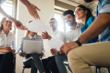 Group of young businesspeople or designers work with new startup project in officeの写真素材