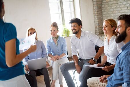 Successful happy group of people learning software engineering and business during presentationの写真素材
