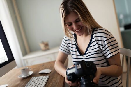 Portrait of young woman designing at homeの写真素材
