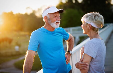Happy senior people running to stay helathy and lose weight