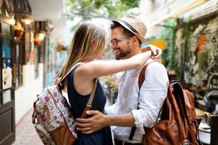 Summer holidays, dating, love and tourism concept. Smiling couple in the cityの写真素材