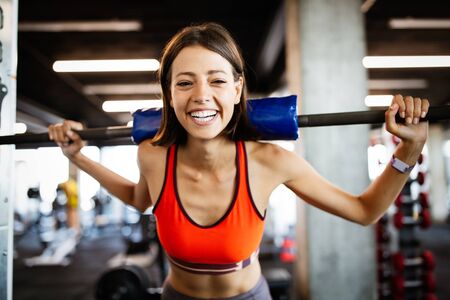 Close up image of attractive fit woman in gym