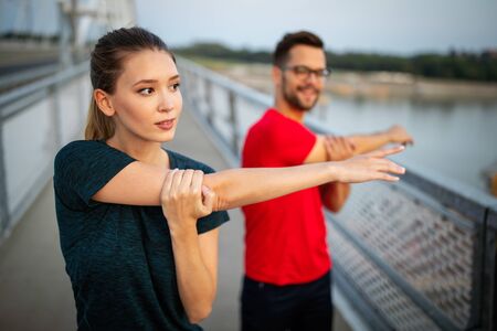 Fitness, sport, people, exercising and lifestyle concept. Couple running outdoor