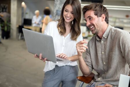 Programmers cooperating at IT company developing appsの写真素材