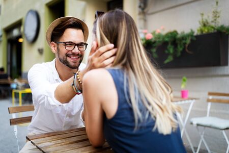 Beautiful couple in love dating outdoors and smilingの写真素材