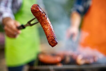 Delicious meat and sausages on the barbecue grillの写真素材