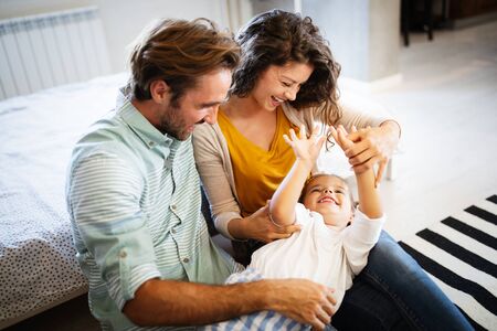 Happy family having fun times at homeの写真素材