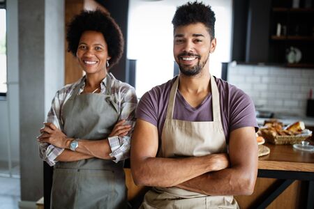 Portrait of happy chefs in kitchen. Healthy food, cooking, people, kitchen concept