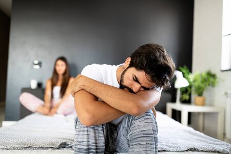Relationship difficulties. Young couple having problems and conflictsの写真素材