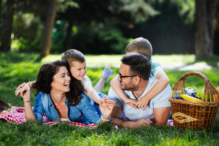 Young family with children having fun in natureの写真素材