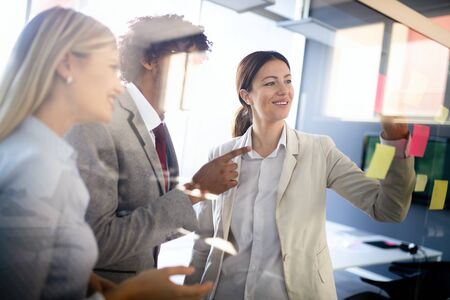 Business coworkers discussing new ideas and brainstorming in a modern office
