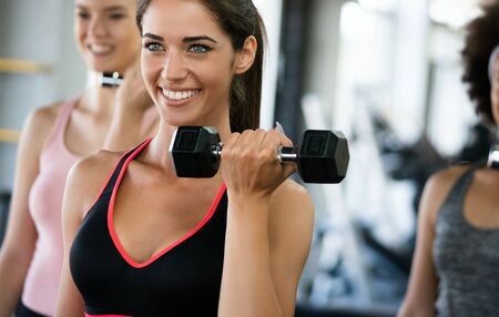 Picture of cheerful fitness team people in gymの写真素材