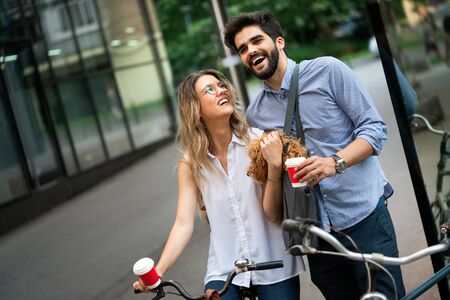Business couple at coffee break outside. Casual business. Business on the go.の写真素材