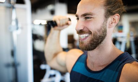 Fitness, sport, exercising and lifestyle concep Young man working out in gym