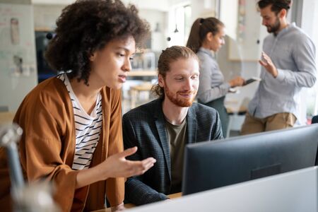 Group of people in a business meeting discussing ideas in office