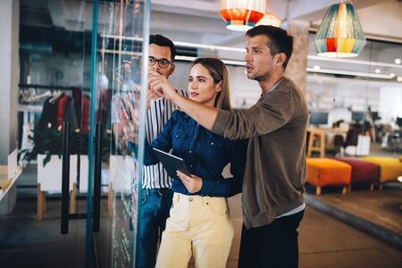 Creative brainstorming. Happy business people, designers, architects working as a team in officeの写真素材