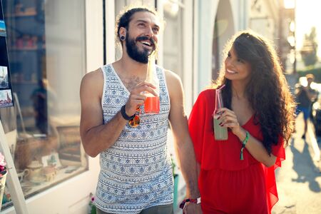 Happy tourist couple in love traveling and bondingの写真素材