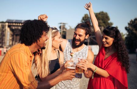 Group of friends having fun time at music festivalの写真素材