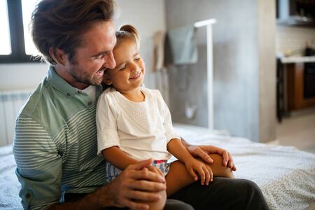 Father and daughter spending time together at homeの写真素材