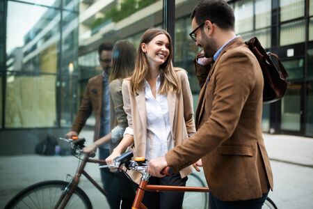 Happy young couple going for a bike ride . Young couple having fun in the city.の写真素材