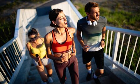 Friends fitness training together outdoors living active healthy