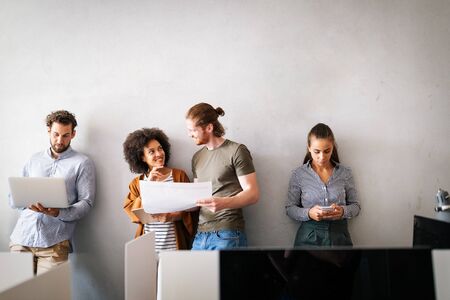Group of business people collaborating on project in office