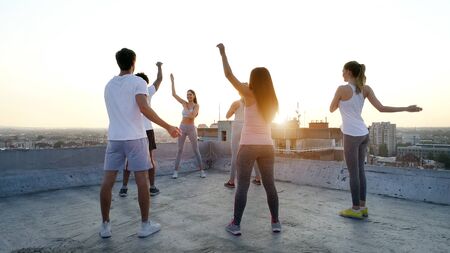 Friends fitness training together outdoors living active healthy