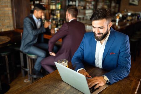 Young business man having a break in a restaurant. Work occupation business lifestyle conceptの写真素材
