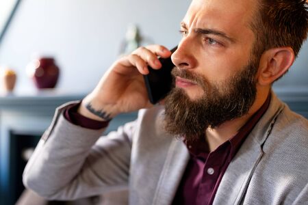 Businessman on the phone receiving bad news. Business, stress work concept