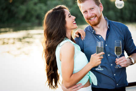 Romantic happy couples dancing and drinking at partyの写真素材