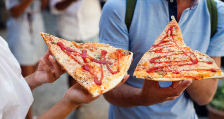 Friends having fun and eating pizza. Dating,consumerism, food and lifestyle concept.