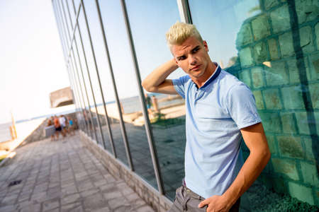 Portrait of a handsome man in urban backgroundの写真素材