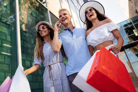 Friends having fun in the city shopping tourism enjoying together