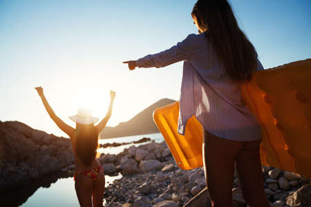Beautiful sexy girls on the beach having fun together.の写真素材
