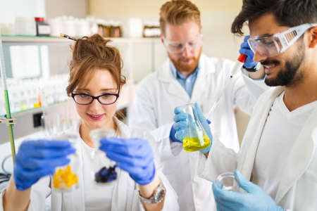Group of medical scientists working at the laboratory. Research virus people conceptの写真素材
