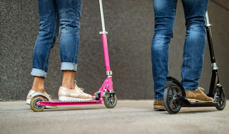 Beautiful woman riding an electric scooter to work, electric transport, ecological transport