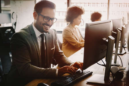Software engineers working on project and programming in companyの写真素材