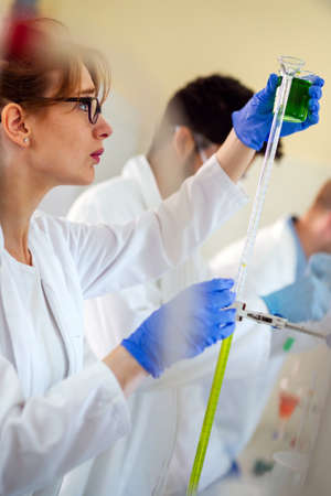 Group of medical scientists working at the laboratory. Research virus people concept