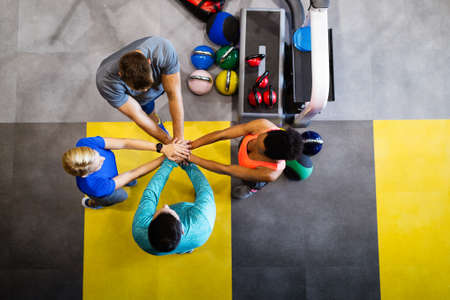 Fitness, sport, training, gym, success concept. Group of happy people in the gym celebrating victoryの写真素材