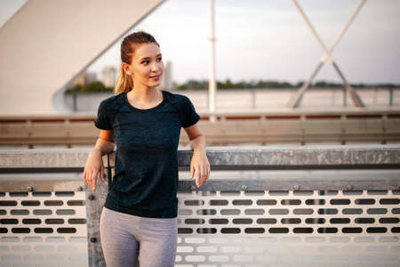 Portrait of woman taking break from running