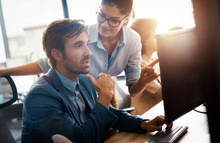 Image of business partners discussing documents and ideasの写真素材
