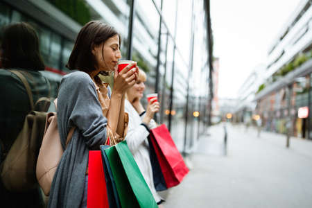 Group of happy women friends having fun, shopping, travelの写真素材