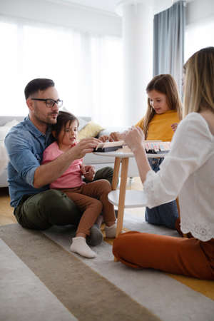 Happy family having fun time at homeの写真素材