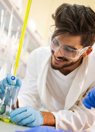 Young scientist student man working at the laboratory